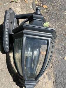 lot 93 image: 2 Black Metal Quoizel Outdoor Light Fixtures with Beveled Glass