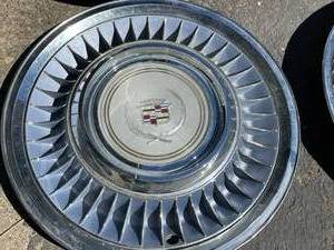 lot 95 image: 4 Vintage Chrysler Hubcaps