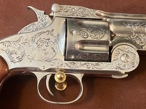 lot 10A image: Franklin Mint Replica Wyatt Earp .44 Revolver Hanging in Frame