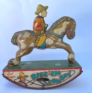 lot 122 image: Vintage Red Ranger RideEm Cowboy Wind Up Toy