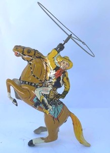 lot 123 image: Vintage Wind Up Lasso Cowboy Toy