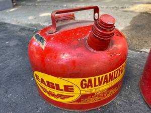 lot 230 image: Two 2.5 Gallon Vintage Metal Eagle Gas Cans With Great Graphics