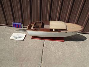 Wood chris craft boat model with stand. 48 x 14. Needs to be finished. As shown.