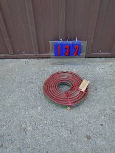 Acetalene torch hose. Appears new. As shown.