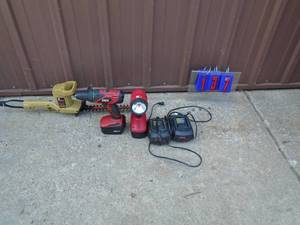 Cordless drill & flashlight with 2 batteries & 2 chargers & hedge trimmer. As shown.