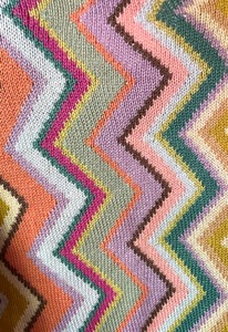 lot 97 image: Colorful Zig Zag Design Zip Up Sweater by Christine Foley