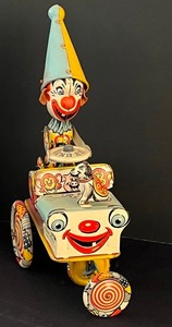 lot 1 image: Unique Vintage 1950s Artie Clown Crazy Car Vintage Wind Up Tin Litho Toy
