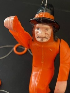 lot 33 image: Vintage Fun World Hard Plastic Pull String Flying Witch Figurine