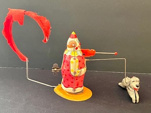 lot 43 image: Wonderfully Fun Wind Up Tin Clown and Acrobatic Dog