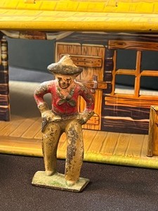 lot 146 image: Vintage Tin Toy Ranch, Two Tin Wagons and Metal Cowboy Figurine