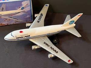 lot 57 image: Vintage Tin Battery Operated Pan-Am Flying Jet Plane