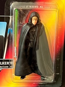 lot 83 image: Two NEW Star Wars The Power of the Force Figurine Princess Leia as Jabbas Prisoner and Luke Skywalker with Removable Cloak & Light Saber