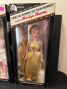 lot 105 image: Two Marilyn Monroe Collector Dolls Marilyn Monroe Seven Year Itch and Theres No Business Like Show Business