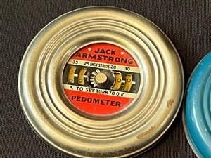 lot 165 image: Two Vintage Jack Armstrong Pedometers