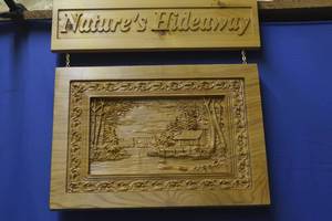hand carved sign by local artist Natures hideaway