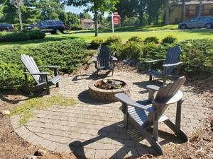 lot 12 image: Four Adirondack Outdoor Chairs By Leasureline