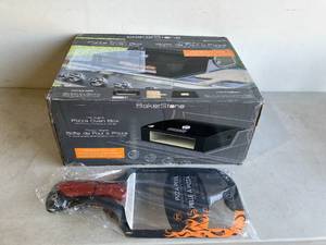 lot 51 image: BakerStone Original Series Grill Top Outdoor Pizza Oven Box Kit and Pizza Peel turner