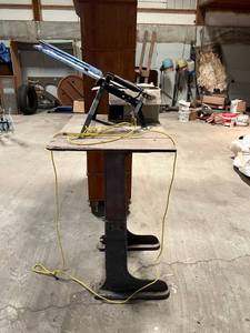 Skeet Thrower on Heavy Stand with Partial Box of Clay Pigeons
