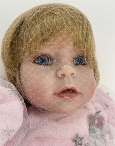 lot 38 image: Adora Dolls- Wizard of Oz Infant Dorothy Doll
