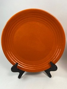 lot 327 image: Vintage Bauer Orange Ringware 12.5 Chop Plate & Light Natural Reed Woven Platter