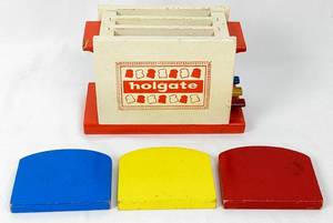 lot 334 image: Vintage Playing Cards and Wood Toys Holgate Toaster, Shackman Nesting Dutch Doll, Sled Frame