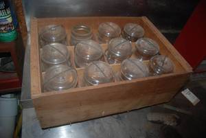 Wood crate with 12 jars containing ...