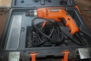Rigid electric drill in case...