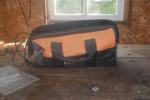 Rigid work bag with battery and cha...