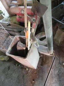Garbage can with paint rollers, bro...