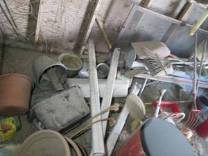 right side of shed includes rakes, ...