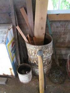 Metal barrel w misc wood and fishi...