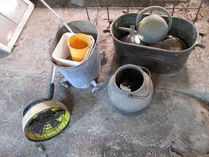Vintage cans, mop bucket, funnel an...