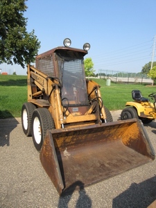 lot 705 image: CASE SKID LOADER WITH DIRT AND SNOW BUCKETS, DIRT AND SNOW TIRES