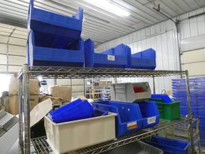 All the plastic bins on the shelving