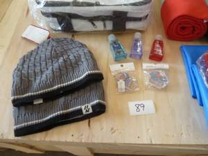Football game pack - 2 stadium blankets, 2 rain ponchos, 2 pair of gloves, 2 stocking hats, hand sanitizer, key chains, bottle opener and a nice collapsible cooler