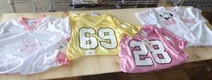 3 girls Vikings jersey shirts and a Red Sox