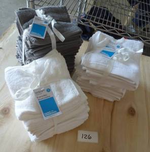 3 stacks of washcloths, I think the white ones have about 12 in them and the grey one has 18
