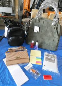 Olive color suede like purse, small travel bag, wallet size purse, post it notes, photo frame, notepad, sanitizer