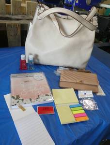 Tan purse and smaller wallet size purse, photo book, post it notes, notepad, sanitizer, keychain