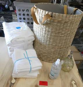Nice large wicker basket, 4 bath towels and 6 wash cloths with sanitizer and dispenser - think Christmas gifts