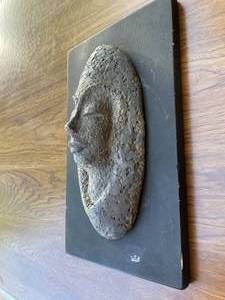 Metal vintage sculpture in solid lead or some type of heavy metal of a womans face