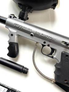 Paint ball gun with parts as pictured. Tested and works.