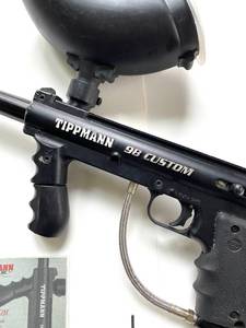 Paintball gun with accessories as seen in pictures. Tested and works.
