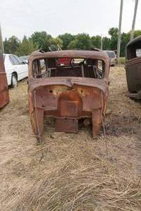 lot 59 image: antique GM car cab with contents