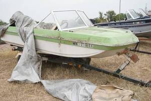 lot 62 image: Calkins boat trailer, Chrysler boat and Mercury 70h motor