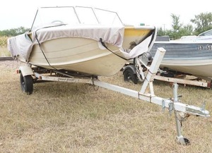 lot 68 image: StarCraft boat with Shoreland trailer and Mercury motor