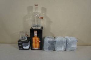 lot 205 image: Lucky Shot Bullet Embedded Whiskey Decanter and Glass Set