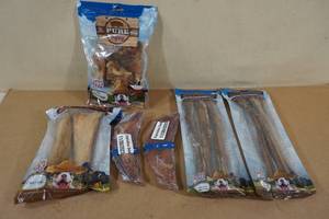 lot 117 image: Assorted Dog Treats -Pigs Ear Strips, Meaty Bones, and Bully Sticks