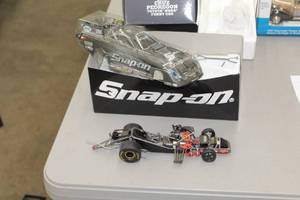lot 857 image: Cruz Pedregon Snap-on 2010 Toyota NHRA Top Fuel Funny Car 124-Scale Collectible