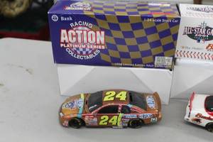 lot 869 image: Jeff Gordon #24 DuPont  Chromalusion 1998 Chevrolet Monte Carlo Stock Car 124-Scale 1 of 15000 Platinum Series Diecast Adult Collectible  by  Action Racing Collectibles